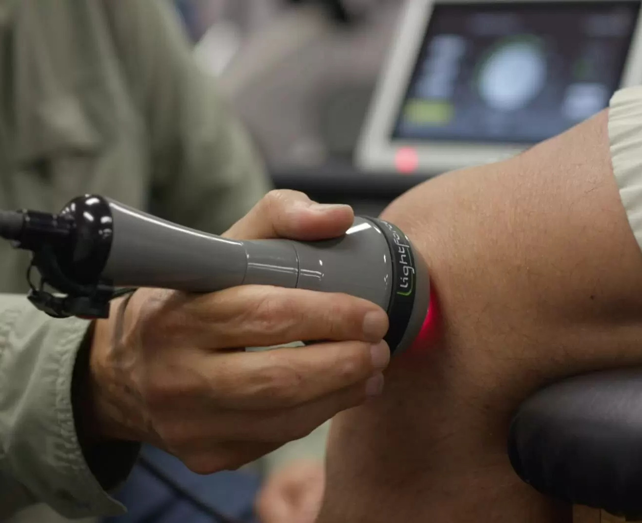 Complete Care 3.0 provider administering laser therapy treatment